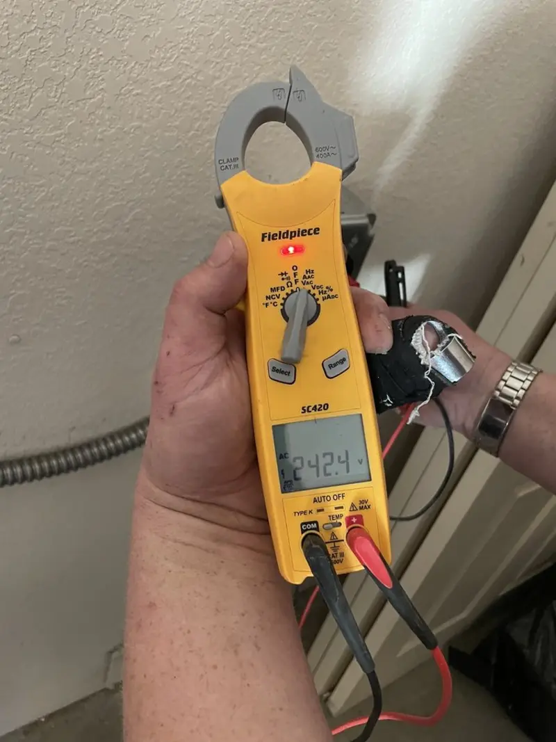 Voltage testing with clamp meter during Whole House Surge Protector in Tyler